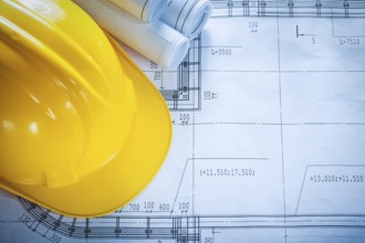 Protective building helmet construction drawings on blueprint