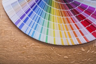 Pantone color palette guide on wooden board construction concept