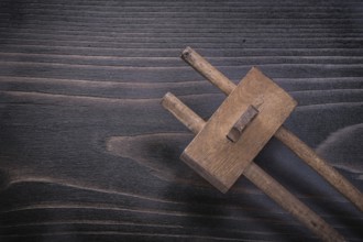 Vintage marking gage on wooden board construction concept