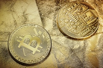 Two bitkoins on gold backgound
