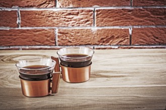 Two copper coffe cups in vintage interior