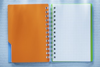 Spiral checked notebook directly above