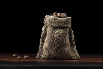 Classic Jute Bag Coffee Beans Standing On Wood Board Isolated