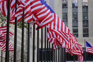 Rockefeller Center, Manhattan, New York, USA, North America, Many American flags fly in front of a