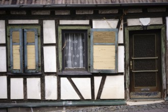 An old rickety half-timbered house with a striking beam construction