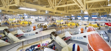 Calgary, Alberta, Canada. Aug 5, 2024. Several vintage aircraft on display in a the Hangar flight