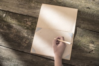 Vintage pencil and drawing paper. Weak sunlight