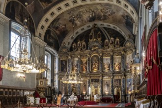 Magnificent interior view of orthodox cathedral with iconostasis and chandeliers