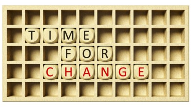 3d rendering of a wooden grid with cubes and the message time for change