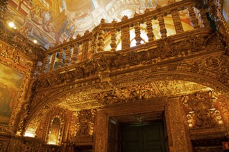 Carvings decorated with gold leaf above the altar of the Church of St Anto, Igreja de Santo