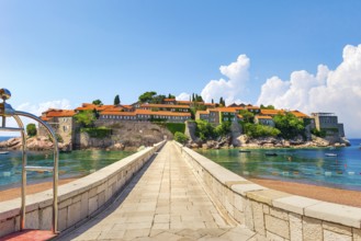 Road to Sveti Stefan, peninsula with ancient architecture in Adriatic sea
