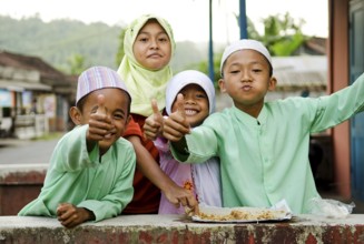 Smiling muslim children in bali indonesia village