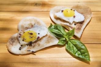 Breakfast of toast and eggs in the shape of heart