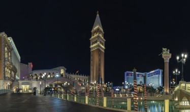 A picture of the Venetian Las Vegas at night, with the Rialto Bridge on the left and the Campanile