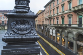 Via dell'Indipendenza street in Bologna, Italy, street lamp detail