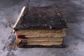 Ancient book, bible, Koran on a dark background