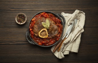 Traditional Italian dish Ossobuco all Milanese made with cut veal shank meat with vegetable tomato