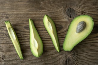 Fresh organic avocado on old wooden table. Avocado on a wooden background