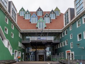 Green town hall (Stadhuis Zaanstad) with interesting 7 triangular pointed dormer windows, Zaandam,
