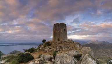 A view of the Albercutx watchtower at Cap de Formentor in northwestern Mallorca at sunrise