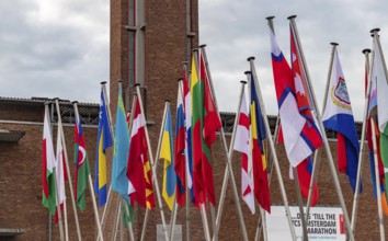 A picture of many country flags in front of the Olympic Stadium as part of the 2022 edition of the