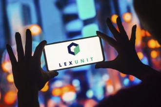 In this photo illustration, the Lexunit logo is displayed on a smartphone screen