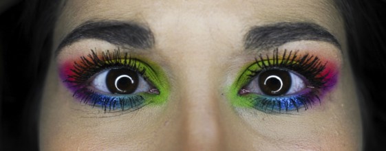 Eye-catching vivid makeup eye details of a young girl. LGBT homosexual flag makeup