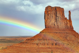 The famous rock Mittens and the bright rainbow. USA. Navajo Indian Reservations. Monument Valley is
