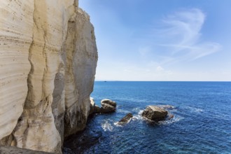 Israel. The color of sea water changes from azure to dark blue. Karst cave Rosh-a-Nikra on the