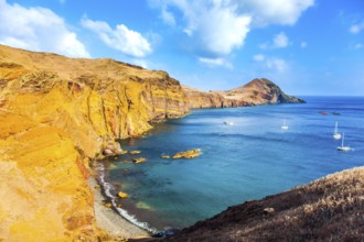 The west coast of the island of Madeira - the bay between the rocks with yachts and boats. Madeira
