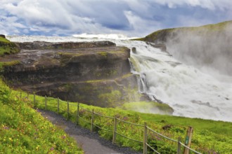 Powerful high-water waterfall in Iceland. For walks and observations on the hillside laid