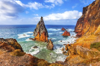 The blinding midday sun illuminates the rocky shore. Madeira is a magical island in the Atlantic.