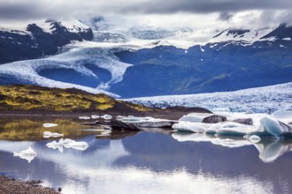 The grand glacier Vatnajokull is melting at the edges, sliding to the ocean. Glacier meltwater form