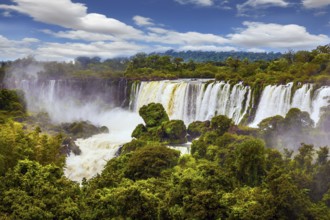 The waterfalls Iguazu. World of falling water. Picturesque basaltic ledges form the famous