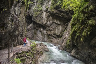 Hiking through the scenic Partnach gorge near Garmisch-Partenkirchen in the Bavarian Alps, Germany