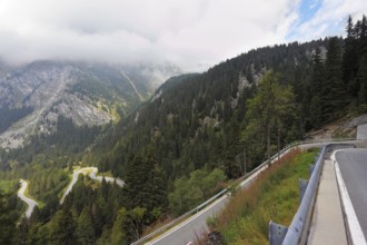 Italy, Dolomites. The magnificent mountain valley. Winding and dangerous road - the Serpentine.