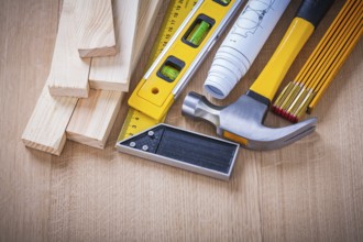 Group of house-improvement working tools on wooden board building and architecture concept