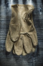 Safety gloves on wooden board