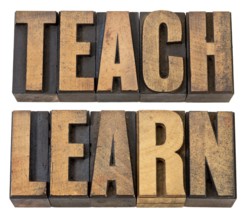 Teach and learn - education concept - isolated words in vintage letterpress wood type