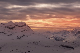 Colored sky at sunset sunset in snowy mountains. Flaine, Grand Massif, France, Arâches-la-Frasse,