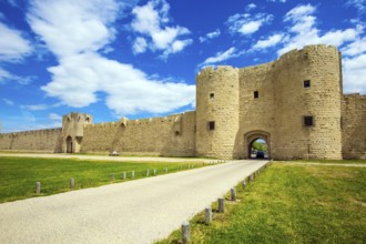 The picturesque powerful gates and fully preserved antique city walls surround the port city of