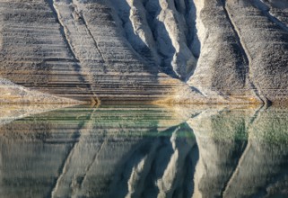 Nature abstract painting created from mountain slopes on water in a lake