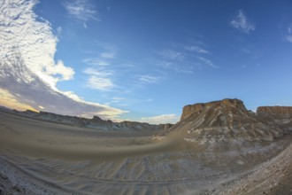 Late afternoon sun casting shadows on rocks in the Libyan desert white desert, Farafra, Egypt
