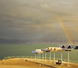 Magnificent rainbow during a spring thunder-storm on the Dead Sea