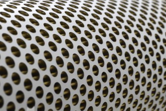 Detail of a tractor oil filter creates an industrial textured background