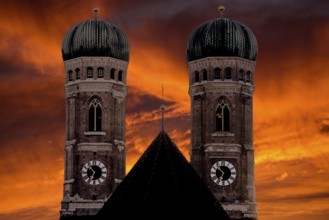 The silhouette of the two church towers of the Church of Our Lady in Munich against a dramatic