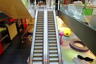Deserted in lockdown: escalator in the shopping mall