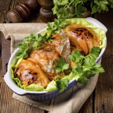 Baked cabbage rolls in tomato sauce