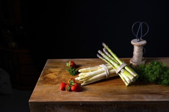 Green and white asparagus on the table