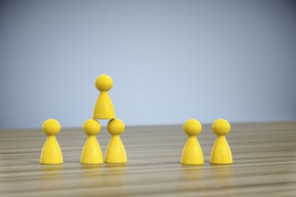 3d illustration of some game figures building a pyramid